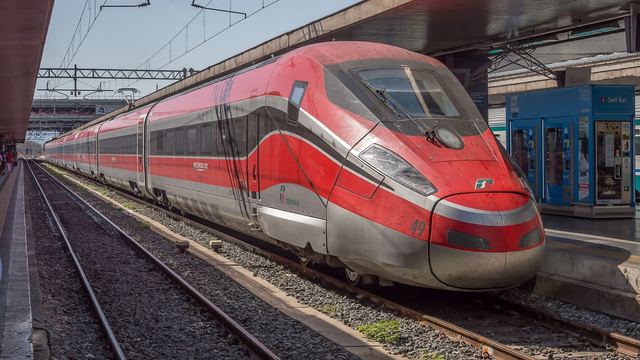 A Frecciarossa high-speed train at the platform, the way to Naples and Florence in under 1 h 30