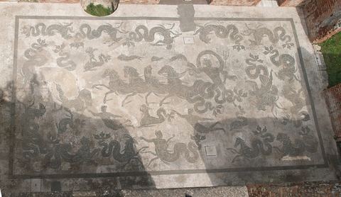 Mosaic floor in the Piazzale delle Corporazioni: each office advertised its trade and home port in black and white tesserae