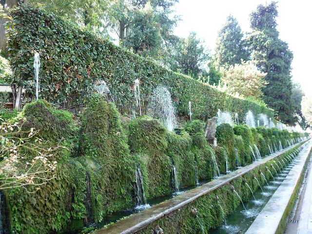 The Hundred Fountains terrace at Villa d'Este in Tivoli, moss-covered spouts running the full width of the garden